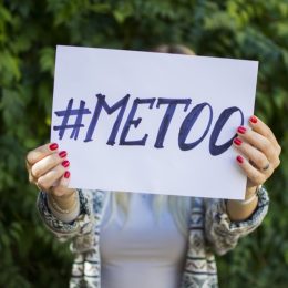 Woman holding a #MeToo sign