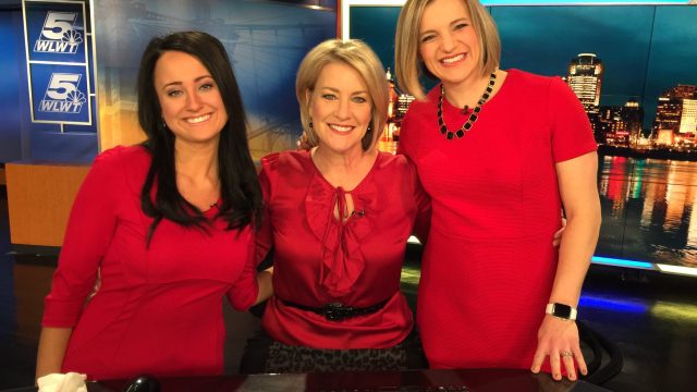 news anchor Lisa Cooney and colleagues wear red for #wearredday
