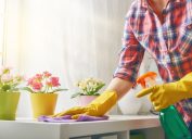 woman dusting countertop, new uses for cleaning products