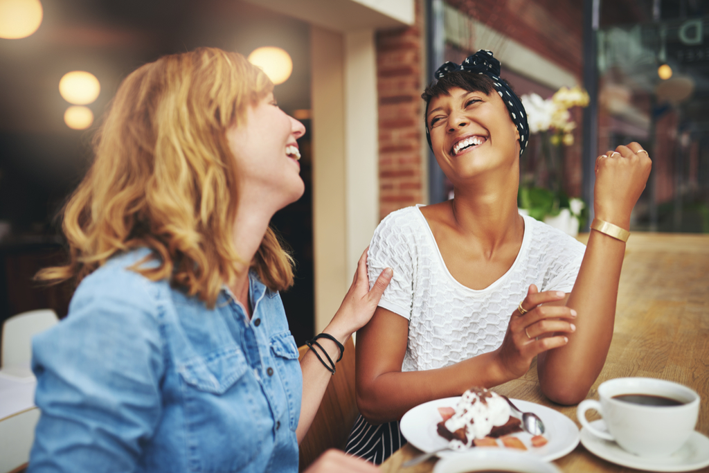 Friends Laughing at Cafe crazy health benefits of laughter