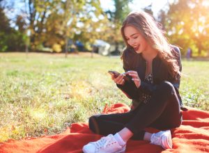 Girl Smiling at Phone Romance