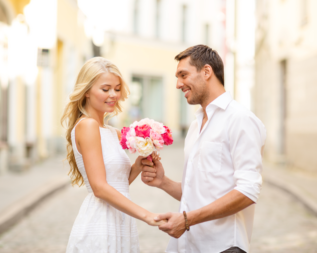 Man Giving Woman Flowers Romance 30 and single