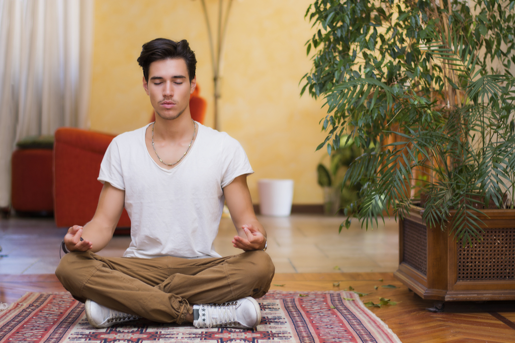 Man Meditating at Home Anti-Aging Science-Based Happiness Hacks 
