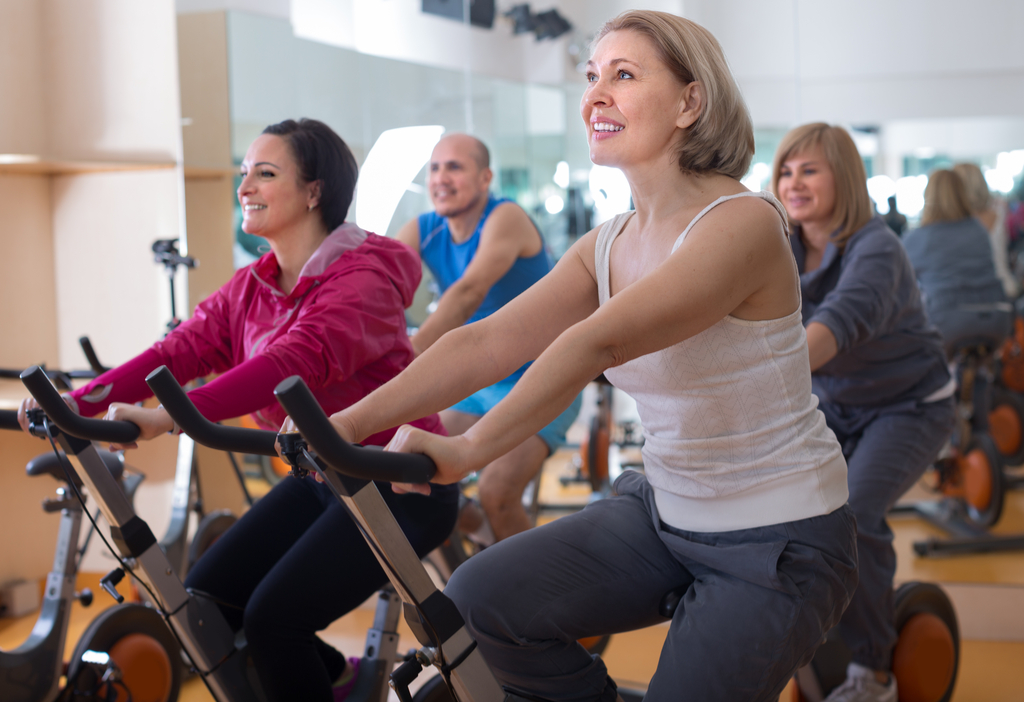 Older Woman on Exercise Bike Changes after 40