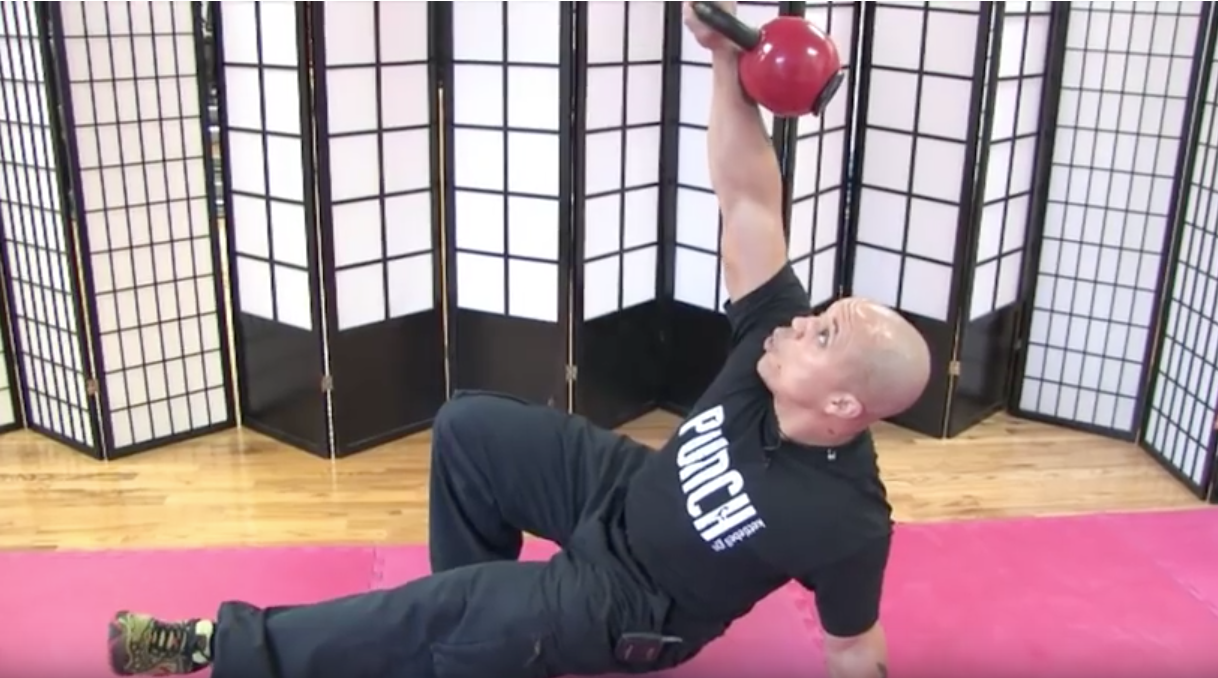 man performs dumbbell iso-holds