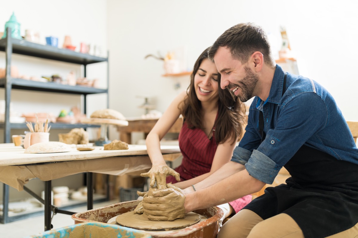 Couple taking a pottery class together
