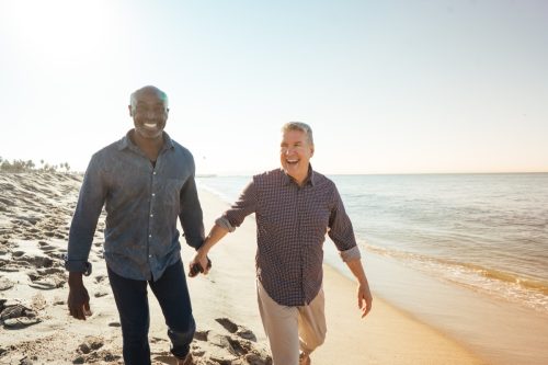 Senior gay couple on the beach on vacation