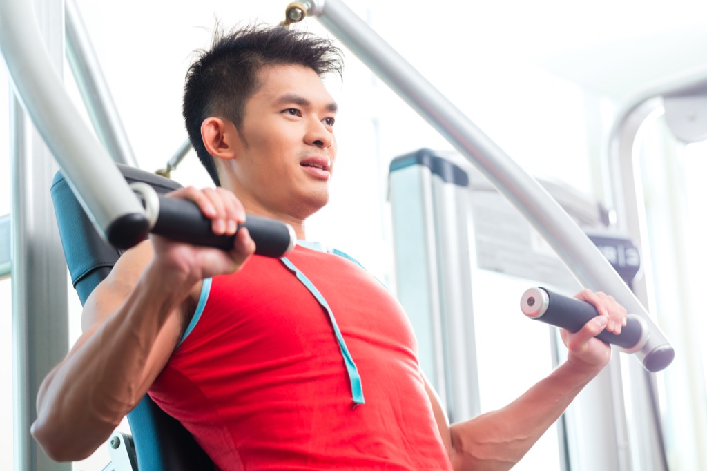man exercising at weight machine, worst things about the suburbs