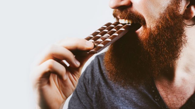 Man with a bar of chocolate