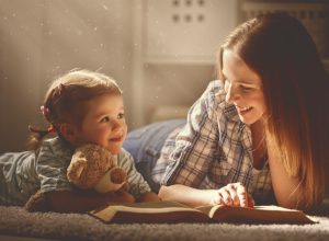 mother reading to daughter prevent heart disease