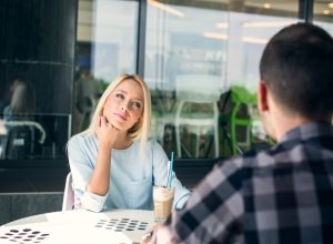 couples drinking coffee- signs hes not into you