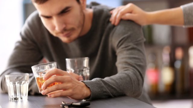 alcoholism and the brain - image of a man who can't stop drinking