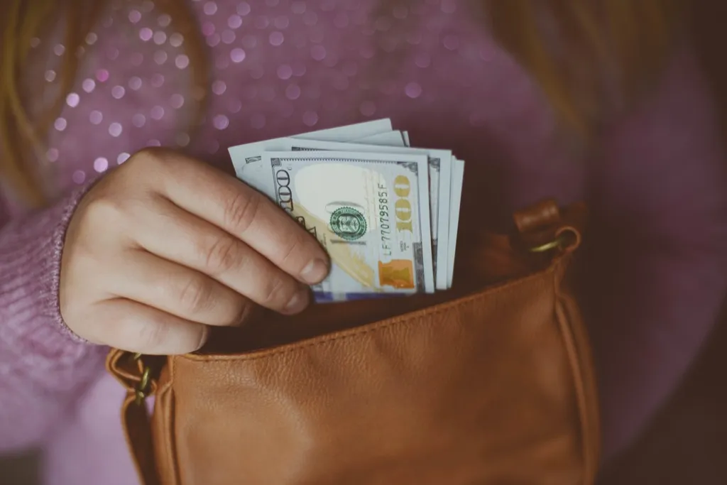Woman with cash in purse