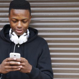 teenager on smartphone differences between millennials and generation z