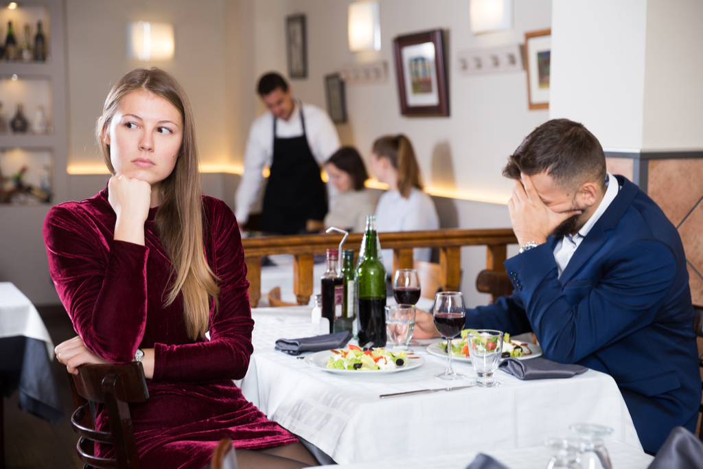 Couple Fighting at Restaurant, signs your husband is cheating
