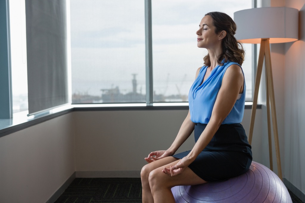 Woman on yoga ball health tweaks over 40