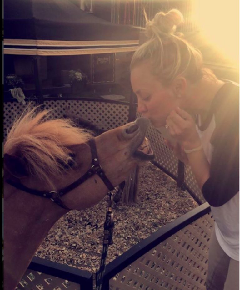 Kaley Cuoco kisses a horse