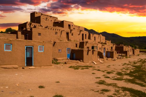 taos traditional adobe homes at sunset