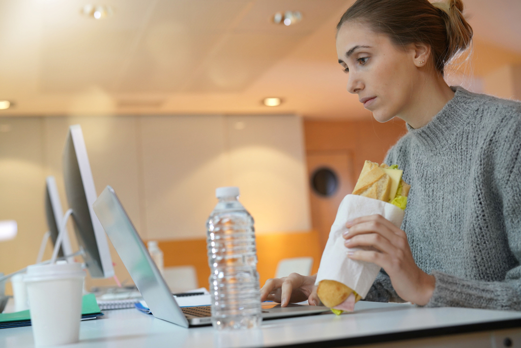 Woman Eating in Front of Computer Natural Urges