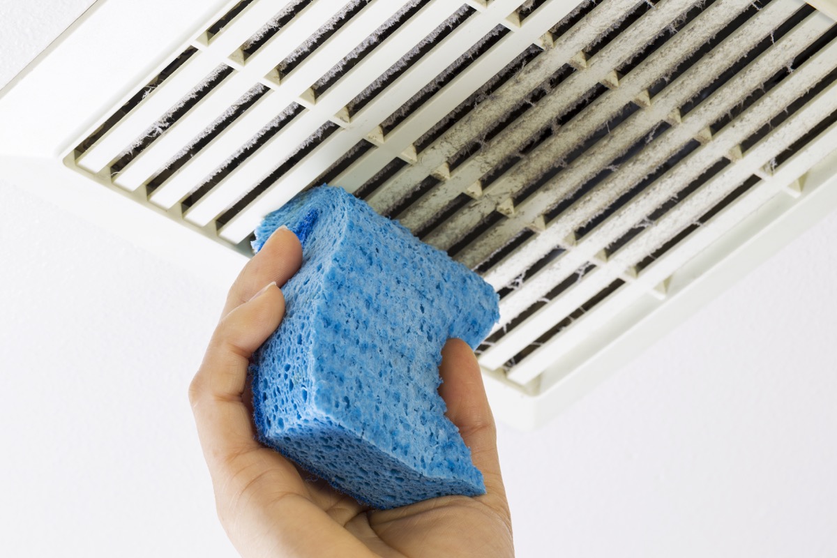 Person Cleaning a Vent with a Sponge, diy hacks