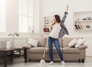 woman dancing and mopping
