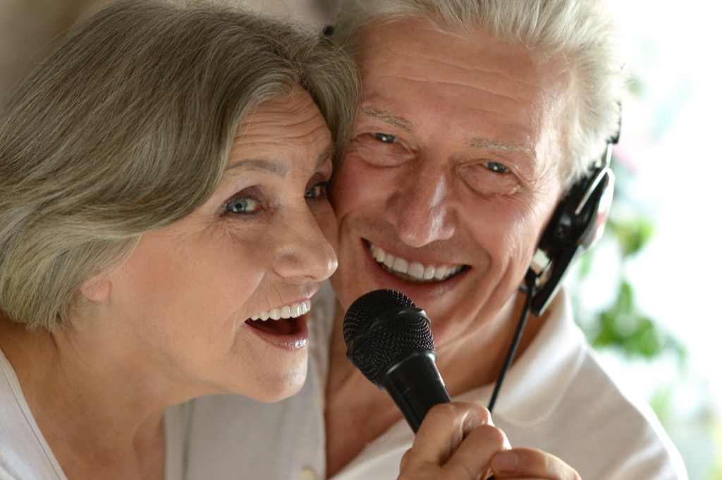 Older Couple Singing Karaoke