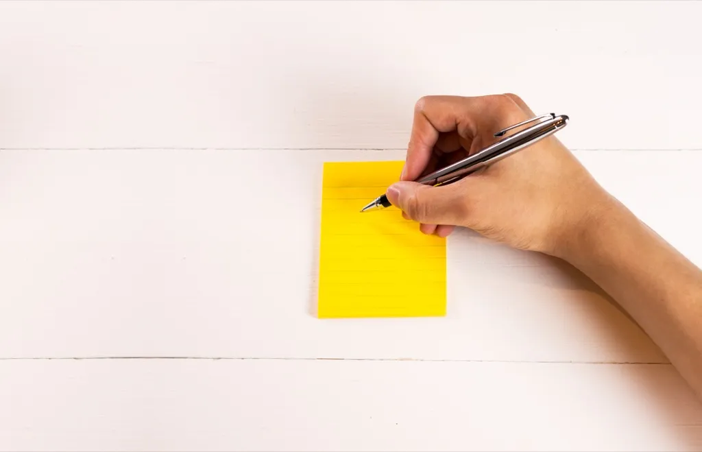 Person writing with right hand
