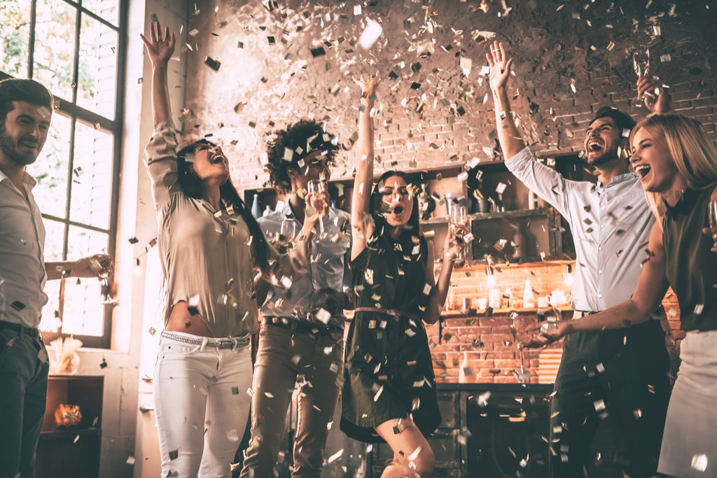 Friends having party with confetti