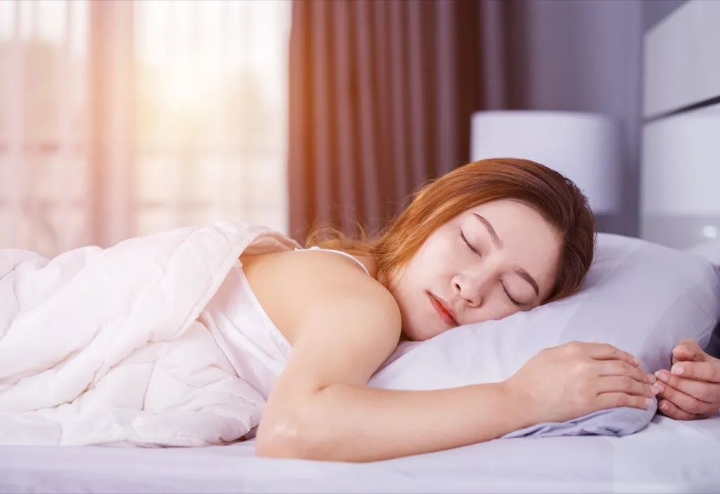 woman sleeping unhealthy heart habits