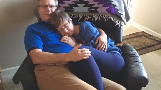 Phyllis Feener curls up with her husband, Stan Feener, in touching viral photo.