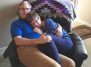 Phyllis Feener curls up with her husband, Stan Feener, in touching viral photo.