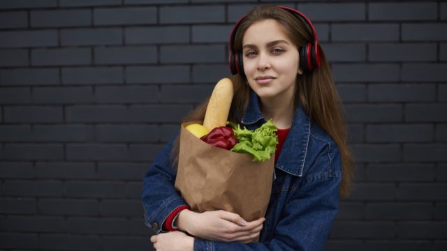Woman Listening to Music While Grocery Shopping Mistakes
