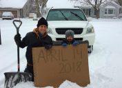 Minnesota dad Aaron Brown recreates winter snowstorm photo with his son that he took with his dad on the same day 35 years ago.