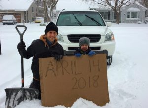 Minnesota dad Aaron Brown recreates winter snowstorm photo with his son that he took with his dad on the same day 35 years ago.