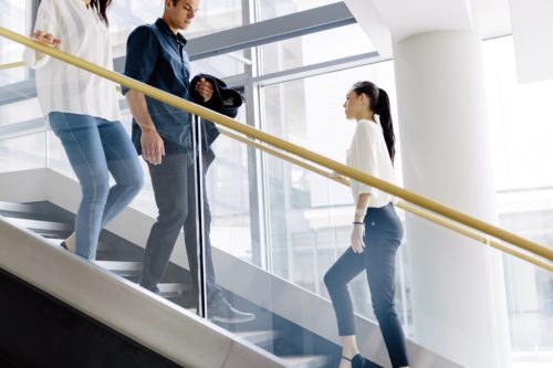 office workers taking the stairs