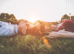 lying in grass outside daily health hacks
