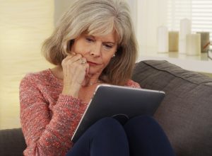 older person on ipad
