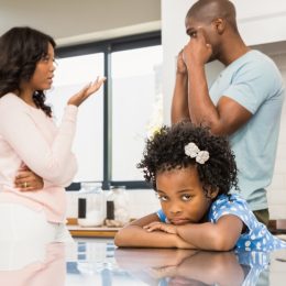 man and women disagreeing in front of daughter, parenting myths