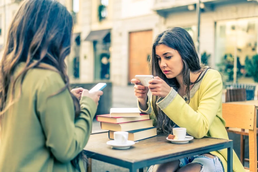 Women on smartphones Facts About Millennials life Changed since 2000s