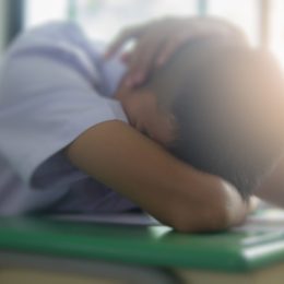 student sleeping at desk