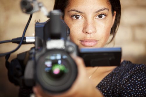 Woman holding film camera