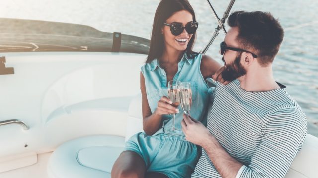 wealthy couple on a boat