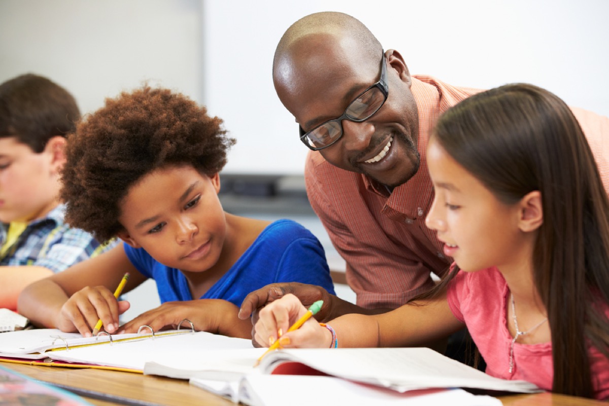 teacher helping students, skills parents should teach kids
