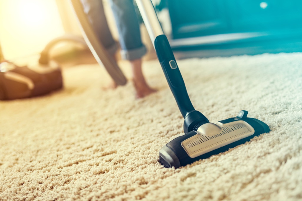 woman vacuuming carpet, vacuuming tips