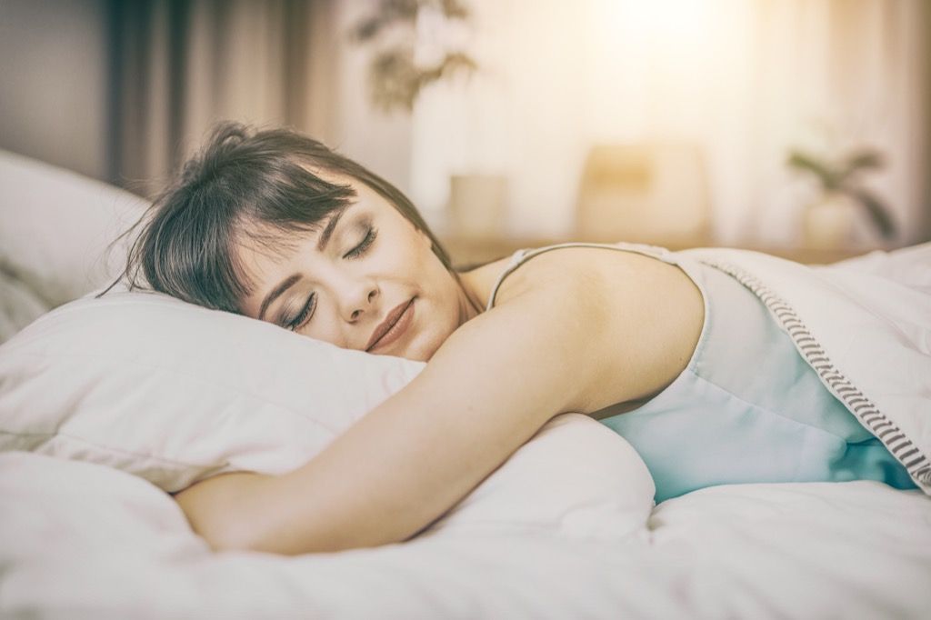 woman sleeping on bed