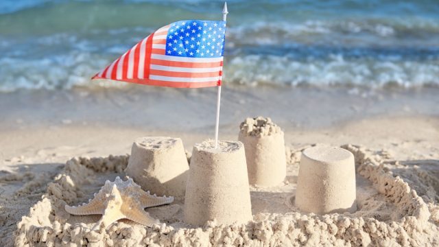 american flag in sand castle on beach facts about the oceans