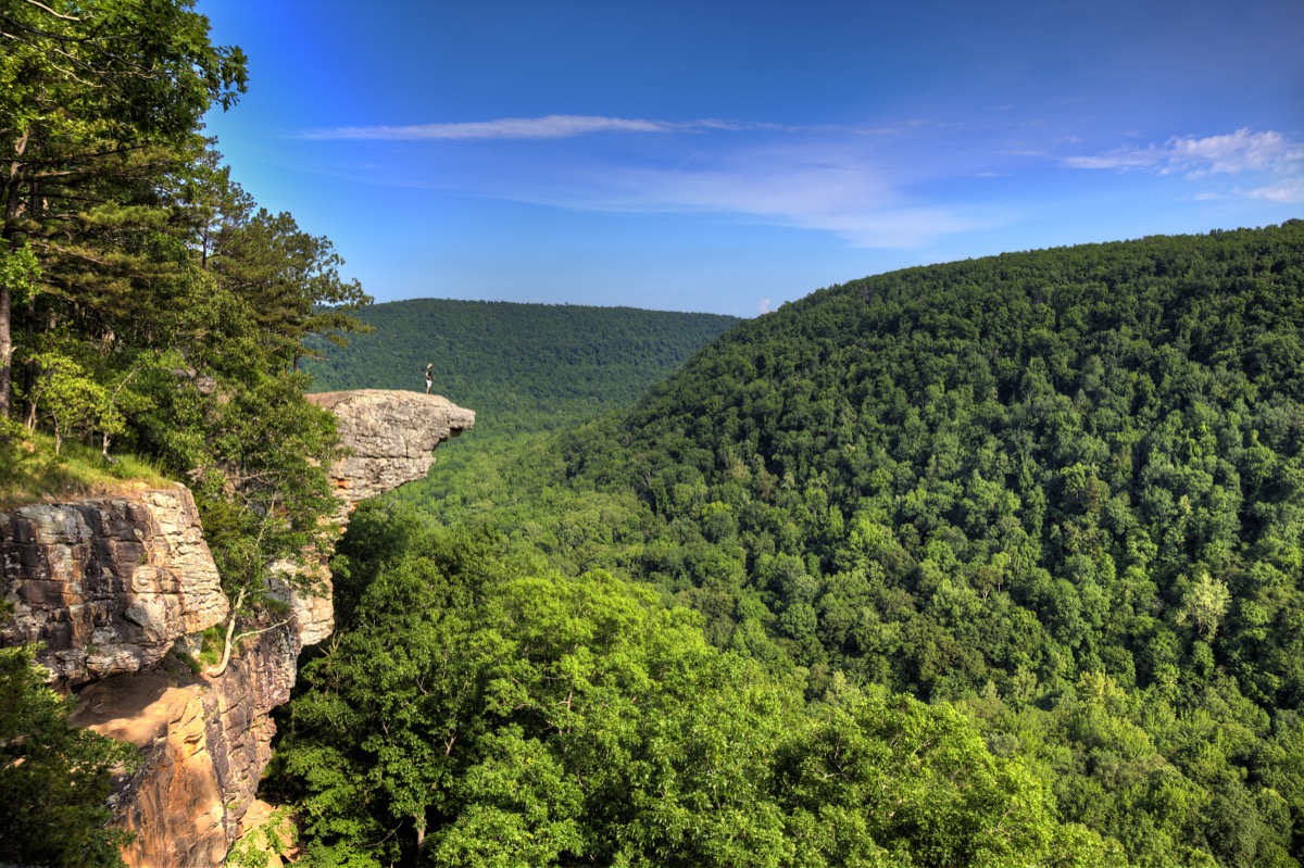 crag juts out among trees in arkansas