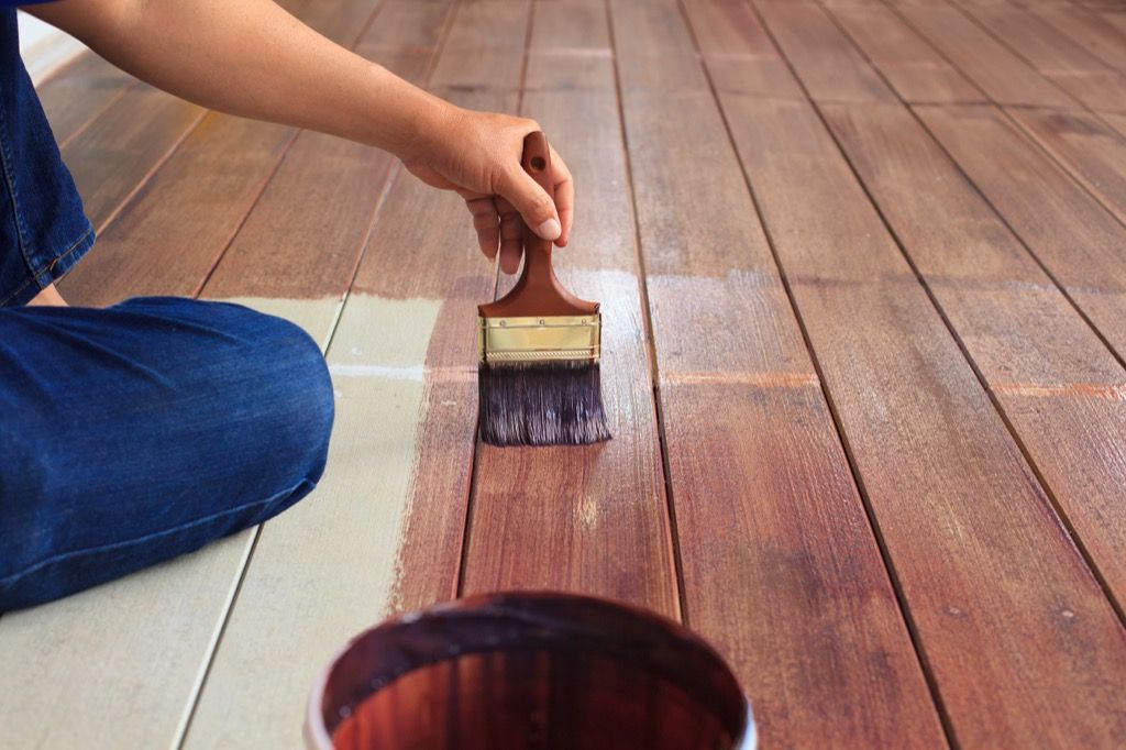 man painting the deck porch paint