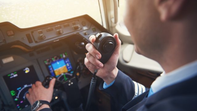 pilot talking on his radio