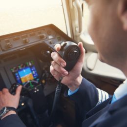 pilot talking on his radio